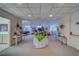 Hallway showing tables, seating and floral arrangements with plenty of room to walk about at 30 Turner St # 203, Clearwater, FL 33756