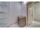 A laundry room features a washer and dryer with built in shelving at 30 Turner St # 203, Clearwater, FL 33756