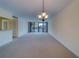 Open-concept floor plan with a combined living and dining area and balcony access at 30 Turner St # 203, Clearwater, FL 33756