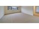 Spacious living area with carpet and a window letting in light at 30 Turner St # 203, Clearwater, FL 33756