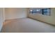 A bright, carpeted living room is shown at 30 Turner St # 203, Clearwater, FL 33756