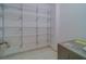 Walk-in pantry features wire shelving and a tile floor at 30 Turner St # 203, Clearwater, FL 33756