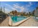 Outdoor community pool, fully fenced, with plenty of space to lounge and enjoy the sun at 30 Turner St # 203, Clearwater, FL 33756