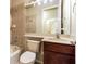 Bathroom featuring tiled shower/tub combination and a vanity with a dark wood cabinet at 3015 Northfield Dr, Tarpon Springs, FL 34688