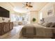 Inviting main bedroom with a bay window seating area, and stylish furnishings at 3015 Northfield Dr, Tarpon Springs, FL 34688