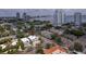 Elevated view showcasing a modern home within a vibrant neighborhood, complete with stunning bay and city skyline backdrop at 3101 W El Prado Blvd # B, Tampa, FL 33629
