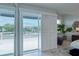 The sunny tiled balcony features a modern railing and views of the neighborhood at 3101 W El Prado Blvd # B, Tampa, FL 33629