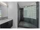 Modern bathroom with glass block shower and dark wood vanity at 3101 W El Prado Blvd # B, Tampa, FL 33629