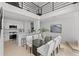 Open-concept dining room features a glass table and adjacent kitchen with white countertops at 3101 W El Prado Blvd # B, Tampa, FL 33629