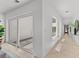 Bright hallway with modern design, featuring courtyard views and connecting to various areas of the home at 3101 W El Prado Blvd # B, Tampa, FL 33629