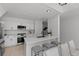 Bright, minimalist kitchen featuring white cabinetry, quartz countertops and stainless steel appliances at 3101 W El Prado Blvd # B, Tampa, FL 33629