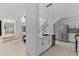 The open-concept kitchen boasts stainless steel appliances, white cabinets, and easy access to the dining area at 3101 W El Prado Blvd # B, Tampa, FL 33629