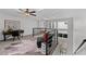 Open loft space with a comfortable sitting area, modern railing, and plenty of natural light at 3101 W El Prado Blvd # B, Tampa, FL 33629