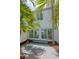 Enclosed tropical backyard features an enclosed patio, landscaping, privacy wall and direct access to the home's interior at 3101 W El Prado Blvd # B, Tampa, FL 33629