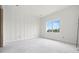 Bright bedroom with modern wall accents, a window and concrete flooring at 3207 N Florida Ave # 1, Tampa, FL 33603