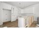 Bright kitchen featuring white cabinets, an island framework, and wood-look floors at 3207 N Florida Ave # 1, Tampa, FL 33603