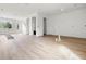 Spacious open-concept living area with hardwood floors and a view of the entry door and fireplace at 3207 N Florida Ave # 1, Tampa, FL 33603