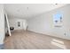Spacious living area with hardwood floors, large windows, and decorative molding on the wall at 3207 N Florida Ave # 1, Tampa, FL 33603
