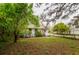 Quaint home with a well-maintained yard, showcasing its curb appeal and inviting atmosphere at 3425 E Powhatan Ave, Tampa, FL 33610