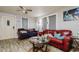 Cozy living room area featuring hard surface floors and comfortable furnishings at 3425 E Powhatan Ave, Tampa, FL 33610
