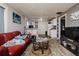View of the living room leads into the kitchen area with hardwood floors throughout at 3425 E Powhatan Ave, Tampa, FL 33610