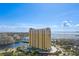 Stunning aerial view of a luxury high-rise building on the water with beautiful city and water views at 345 Bayshore Blvd # 412, Tampa, FL 33606