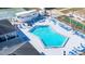 Community amenities featuring a pristine pool with ample lounging space, hot tub, and grilling area at 35145 Garber Ln, Zephyrhills, FL 33541