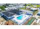 Overhead view of community's amenities featuring swimming pool, spa, tennis, and shuffleboard courts at 35145 Garber Ln, Zephyrhills, FL 33541