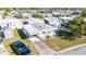 Aerial shot of property featuring single-story home with parking in a residential neighborhood at 35145 Garber Ln, Zephyrhills, FL 33541