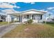 Single story home with covered parking and small front porch at 35145 Garber Ln, Zephyrhills, FL 33541
