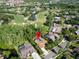 Stunning aerial view of a pool home nestled within a golf course community at 375 Holly Hill Rd, Oldsmar, FL 34677