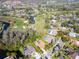 Beautiful aerial view of homes near a golf course, showcasing serene landscapes, and manicured greenery at 375 Holly Hill Rd, Oldsmar, FL 34677