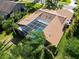 Aerial view featuring the house's pool area and overall backyard design at 375 Holly Hill Rd, Oldsmar, FL 34677