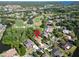 An aerial image showcasing a lovely home by the golf course at 375 Holly Hill Rd, Oldsmar, FL 34677