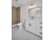 Updated bathroom featuring modern white vanity, quartz countertops, bronze fixtures, and a walk-in shower at 375 Holly Hill Rd, Oldsmar, FL 34677