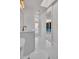 Bright bathroom with modern fixtures, a large mirror, and a view of the pool area at 375 Holly Hill Rd, Oldsmar, FL 34677