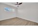 Bedroom with a ceiling fan and a window providing natural light at 375 Holly Hill Rd, Oldsmar, FL 34677