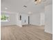 Bright and airy living room with wood floors and a view to the outside at 375 Holly Hill Rd, Oldsmar, FL 34677