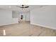 Bright living room featuring modern flooring, ceiling fan and neutral decor at 375 Holly Hill Rd, Oldsmar, FL 34677