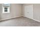 A bright bedroom features soft carpeting and a double-door closet at 4017 W North B St, Tampa, FL 33607