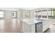 White kitchen with an island and stainless steel appliances at 4017 W North B St, Tampa, FL 33607