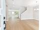 Bright living room boasts hardwood floors, recessed lighting, and a staircase leading to the upper level at 4017 W North B St, Tampa, FL 33607