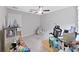 Bedroom featuring a ceiling fan, carpet, window, desk, and chair at 4136 Shrewbury Pl, Land O Lakes, FL 34638