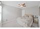 Bedroom featuring a ceiling fan, carpet, window and a queen sized bed at 4136 Shrewbury Pl, Land O Lakes, FL 34638