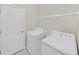 Bright laundry room area with new washing machine, new dryer and storage shelf at 4136 Shrewbury Pl, Land O Lakes, FL 34638
