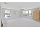 Spacious loft bathed in natural light, offering ample room for lounging or as a play area at 4136 Shrewbury Pl, Land O Lakes, FL 34638