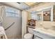Bathroom featuring a shower, toilet, sink with vanity, and safety bars at 4215 Regal Pl, New Port Richey, FL 34652