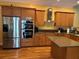 Well-equipped kitchen with stainless steel appliances and light wood cabinetry at 429 Grant St, Dunedin, FL 34698