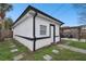 Exterior view of a home's back showcasing a neatly kept yard at 455 49Th N Ave, St Petersburg, FL 33703