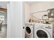 Functional laundry room with washer, dryer, and storage space at 455 49Th N Ave, St Petersburg, FL 33703